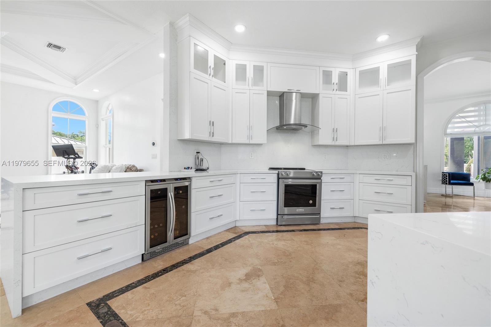 11950 Southwest 43rd Street Miami, FL 33175 - Photo 43 of 78 a kitchen with stainless steel appliances a stove sink and cabinets