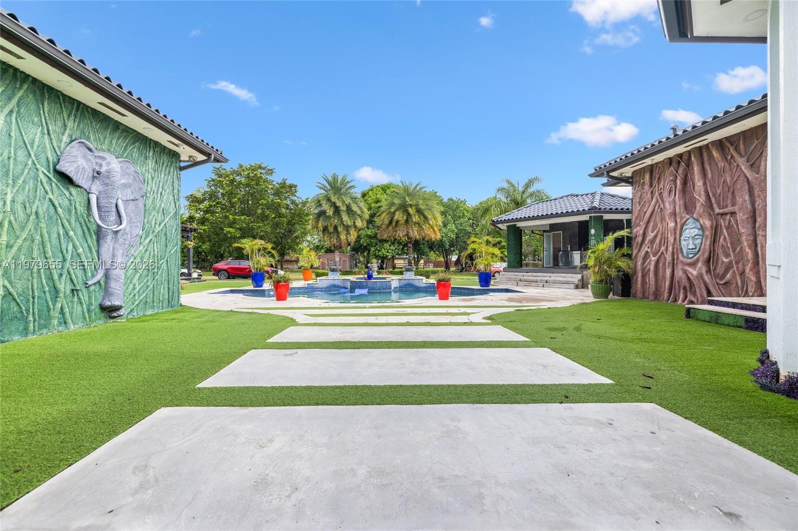 11950 Southwest 43rd Street Miami, FL 33175 - Photo 49 of 78 a view of outdoor space with garden and seating area