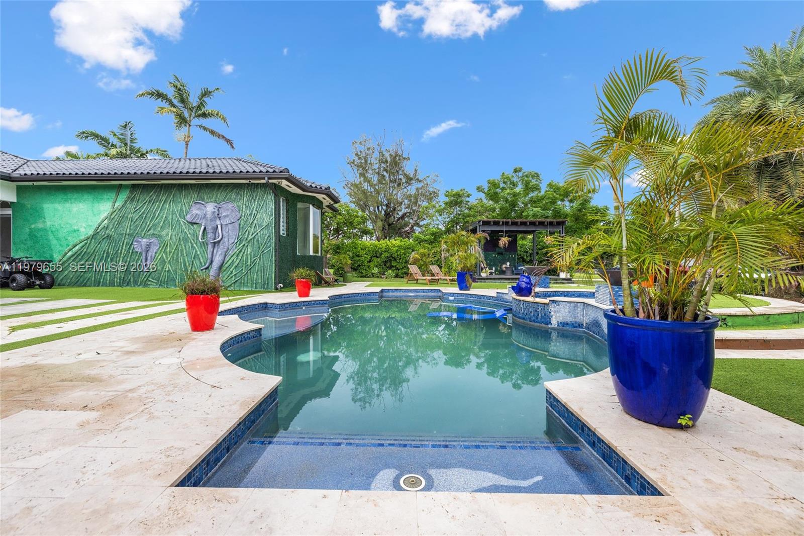 11950 Southwest 43rd Street Miami, FL 33175 - Photo 50 of 78 a view of a backyard house with swimming pool