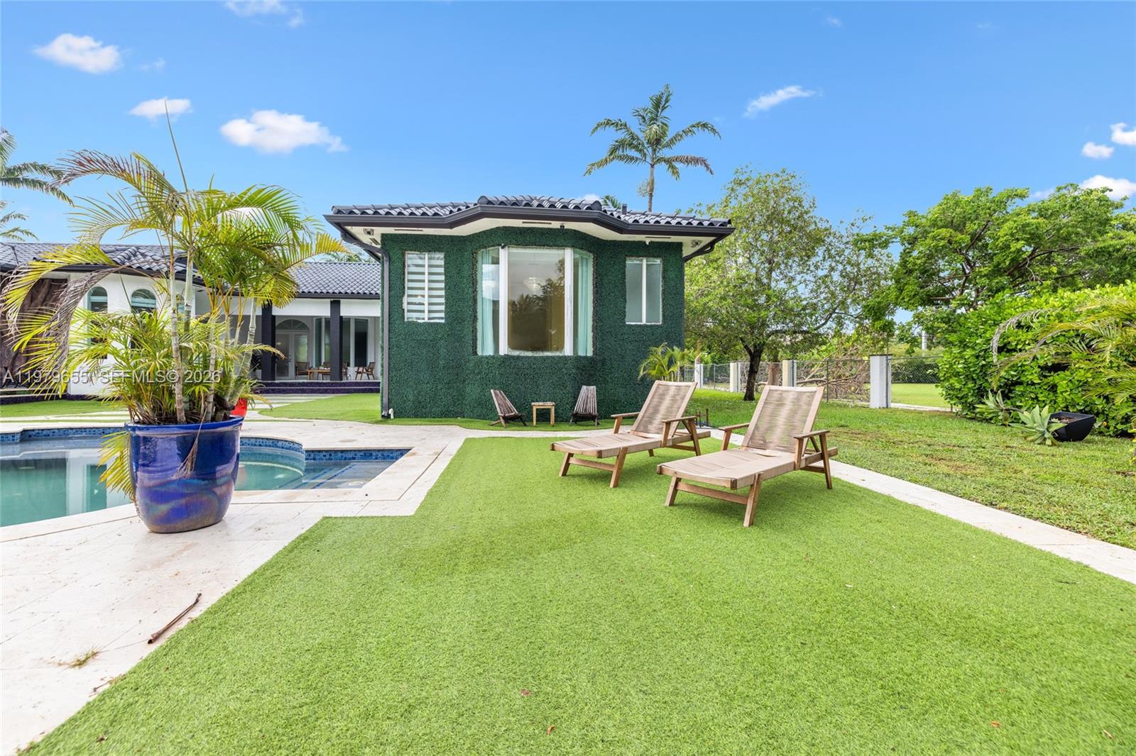 11950 Southwest 43rd Street Miami, FL 33175 - Photo 53 of 78 a view of a house with backyard porch and sitting area