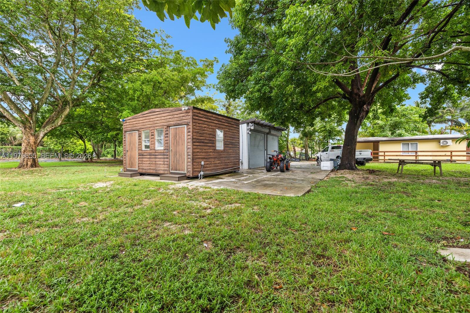 11950 Southwest 43rd Street Miami, FL 33175 - Photo 59 of 78 a view of a house with backyard and a tree