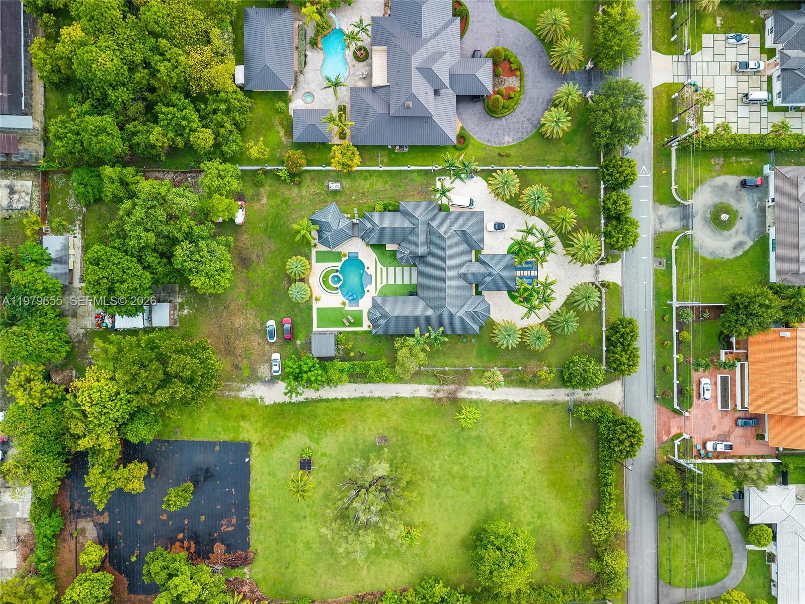 11950 Southwest 43rd Street Miami, FL 33175 - Photo 6 of 78 an aerial view of residential houses with outdoor space and street view