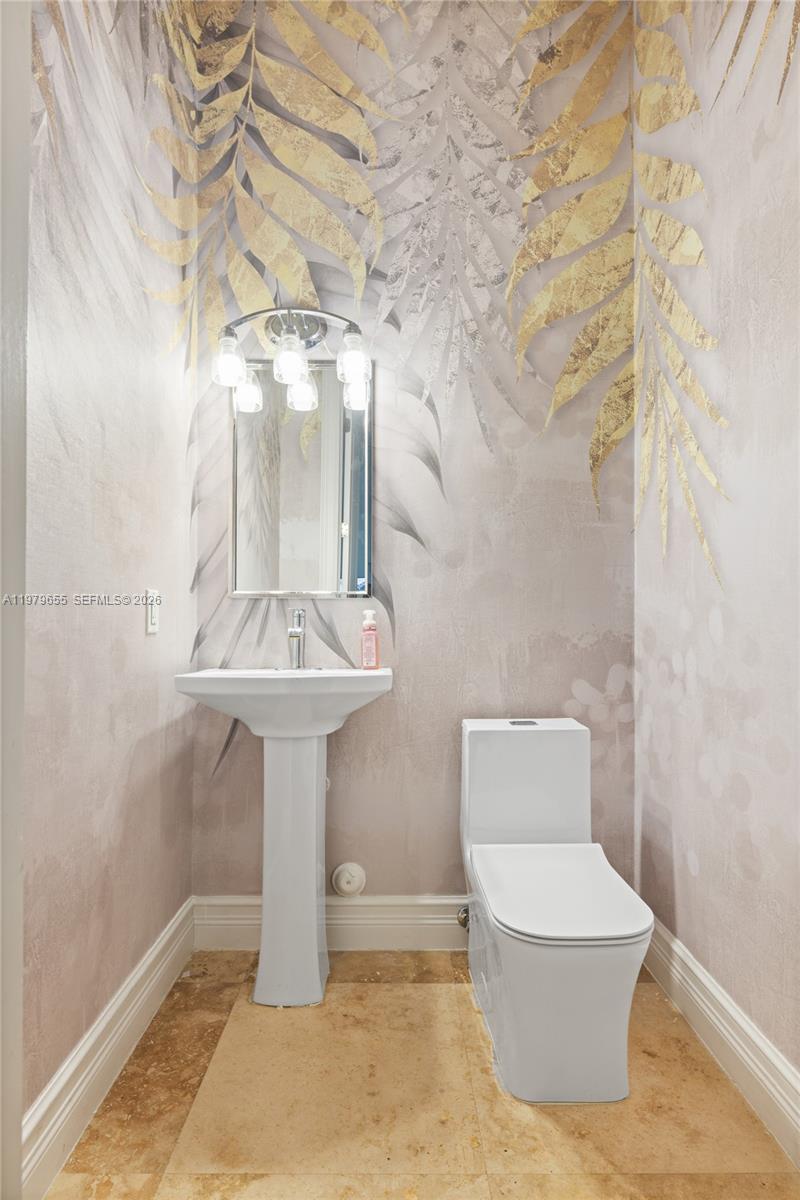 11950 Southwest 43rd Street Miami, FL 33175 - Photo 72 of 78 a bathroom with a toilet sink and mirror