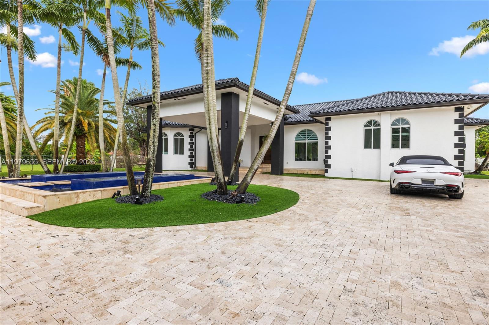 11950 Southwest 43rd Street Miami, FL 33175 - Photo 9 of 78 a house view with a garden space