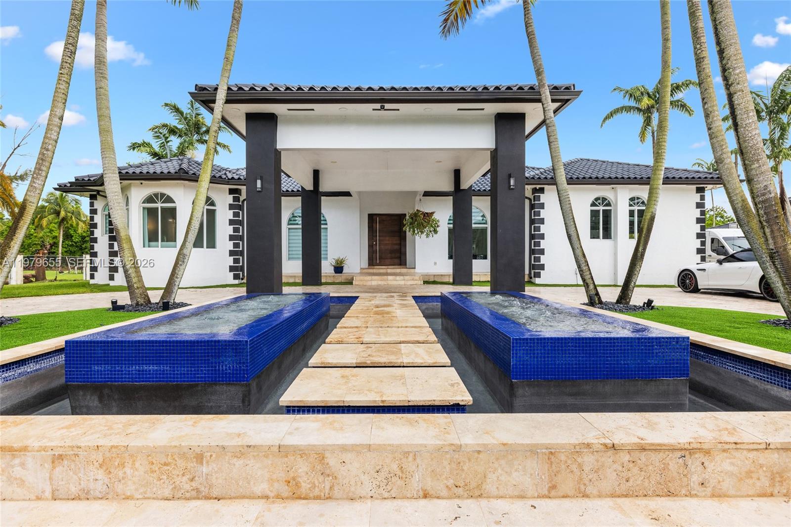 11950 Southwest 43rd Street Miami, FL 33175 - Photo 10 of 78 a front view of a house with garden