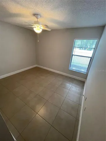 a view of a bathroom with a sink and mirror