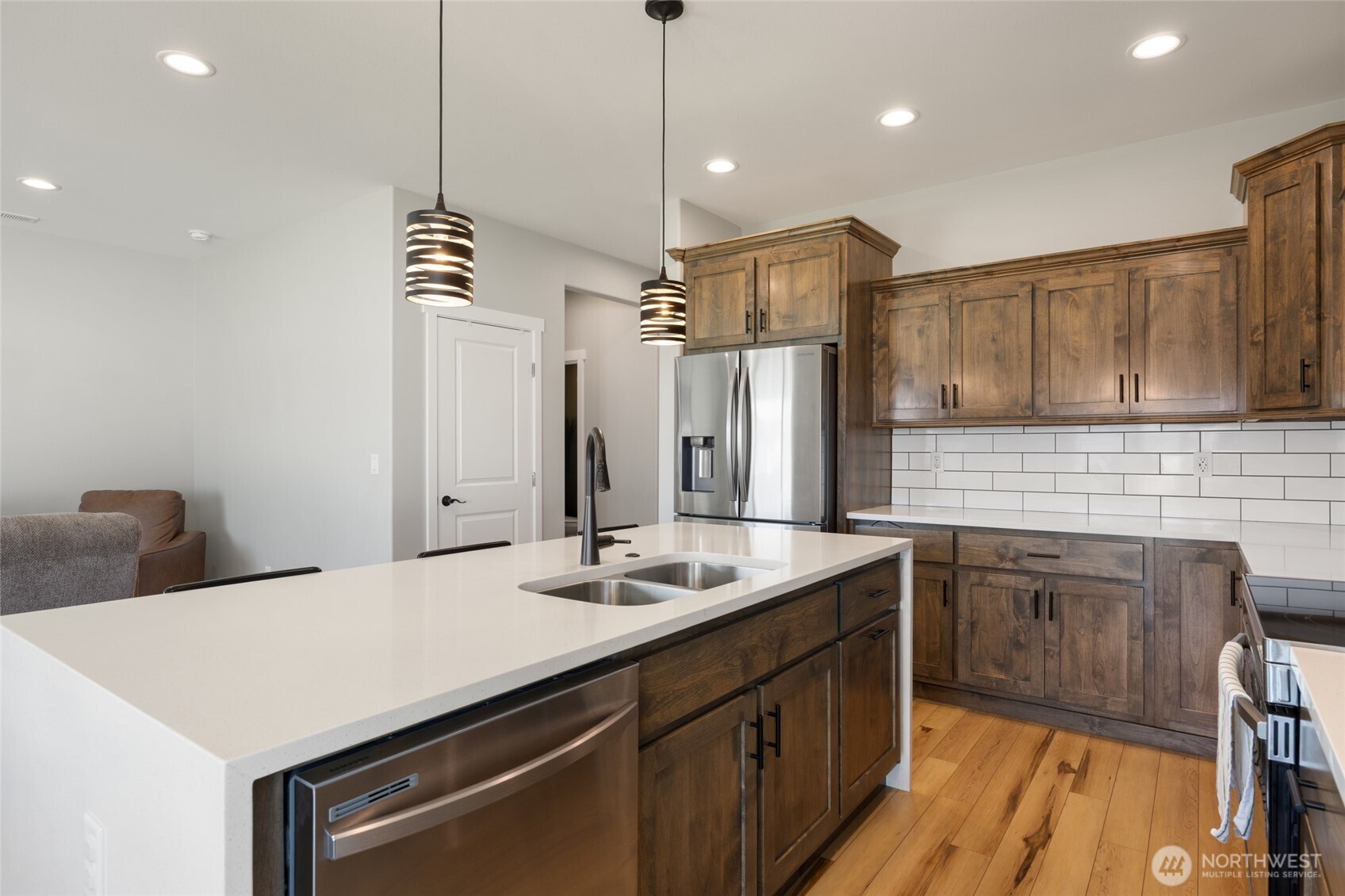 2376 Chelan Street Ephrata, WA 98823 - Photo 15 of 40 a kitchen with stainless steel appliances a sink a stove a refrigerator and island