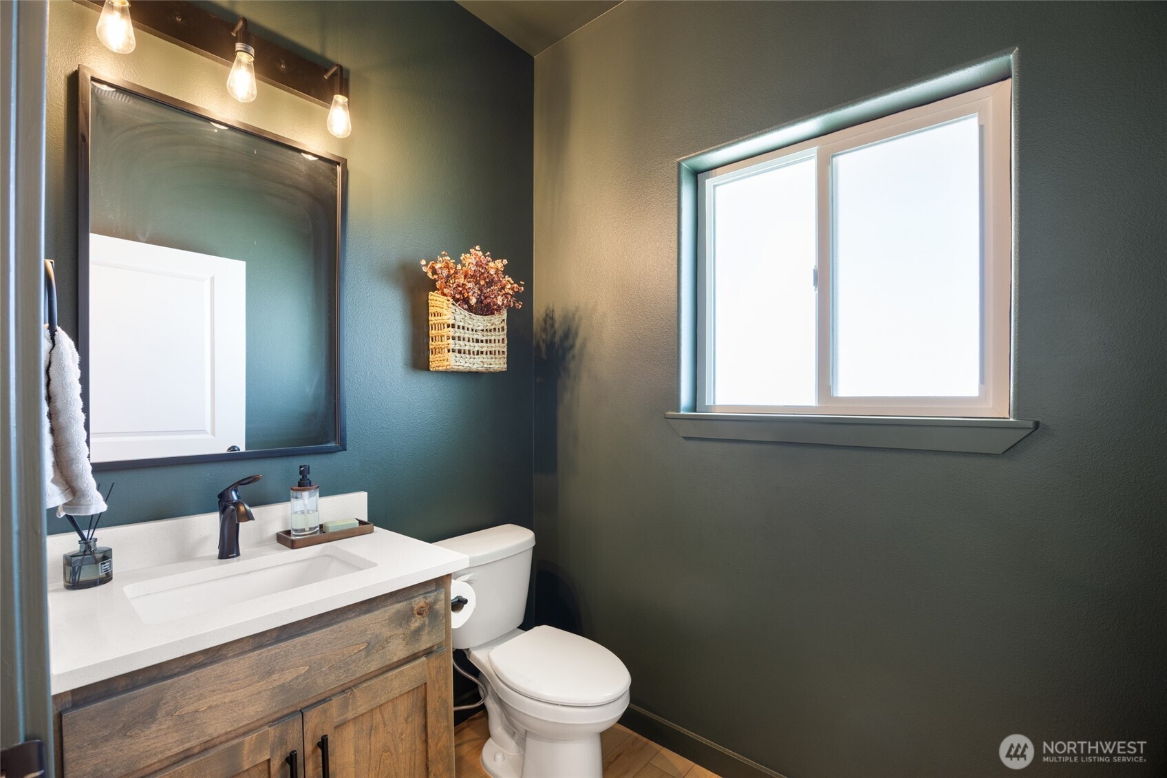 2376 Chelan Street Ephrata, WA 98823 - Photo 16 of 40 a bathroom with a sink a toilet and a mirror