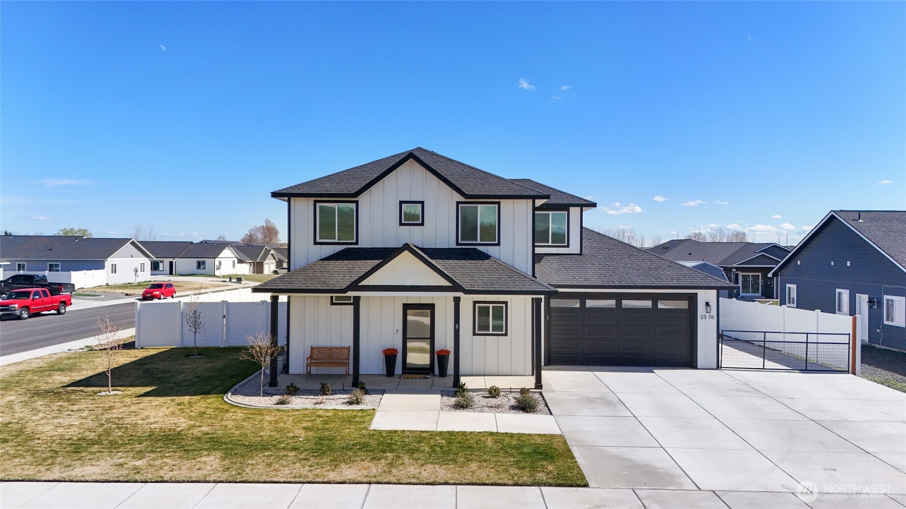 2376 Chelan Street Ephrata, WA 98823 - Photo 35 of 40 a front view of a house with a porch and a yard