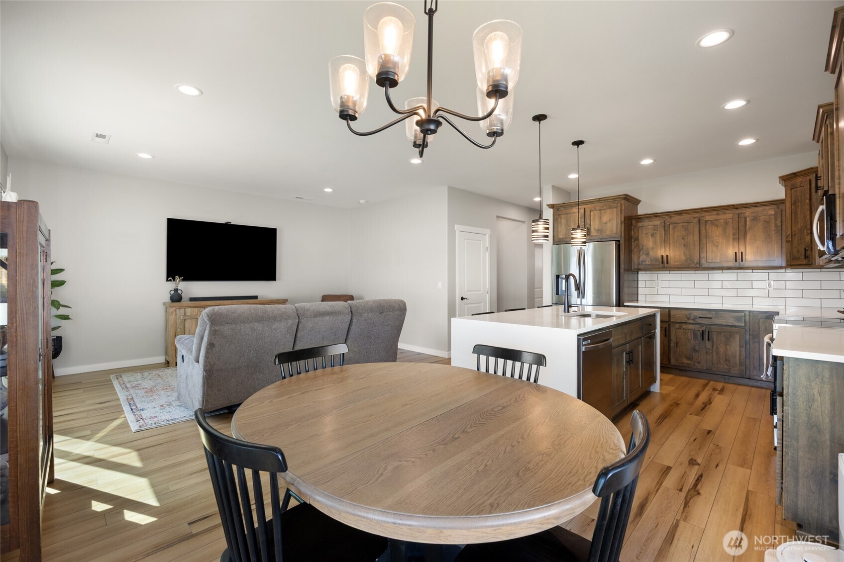 2376 Chelan Street Ephrata, WA 98823 - Photo 10 of 40 a living room with furniture a flat screen tv and kitchen view