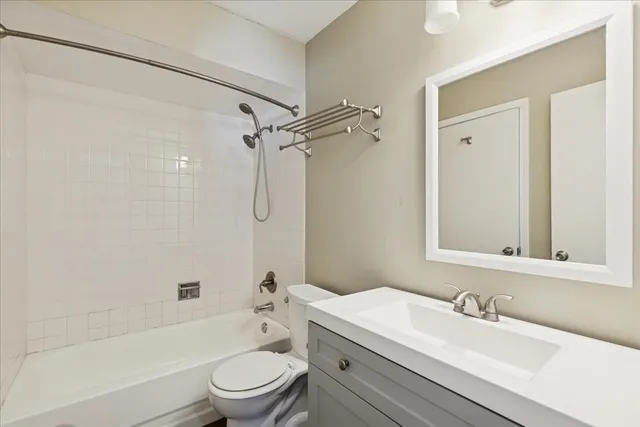 a bathroom with a sink a toilet and a bathtub