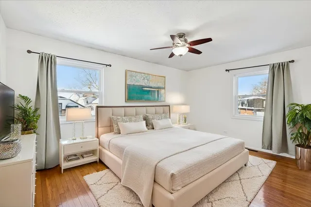 a bedroom with a large bed and a window