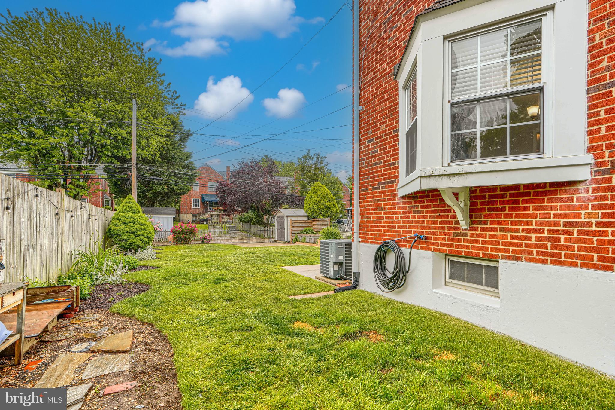8132 Pleasant Plains Road Towson, MD 21286 - Photo 45 of 55 a view of a backyard with table and chairs and potted plants