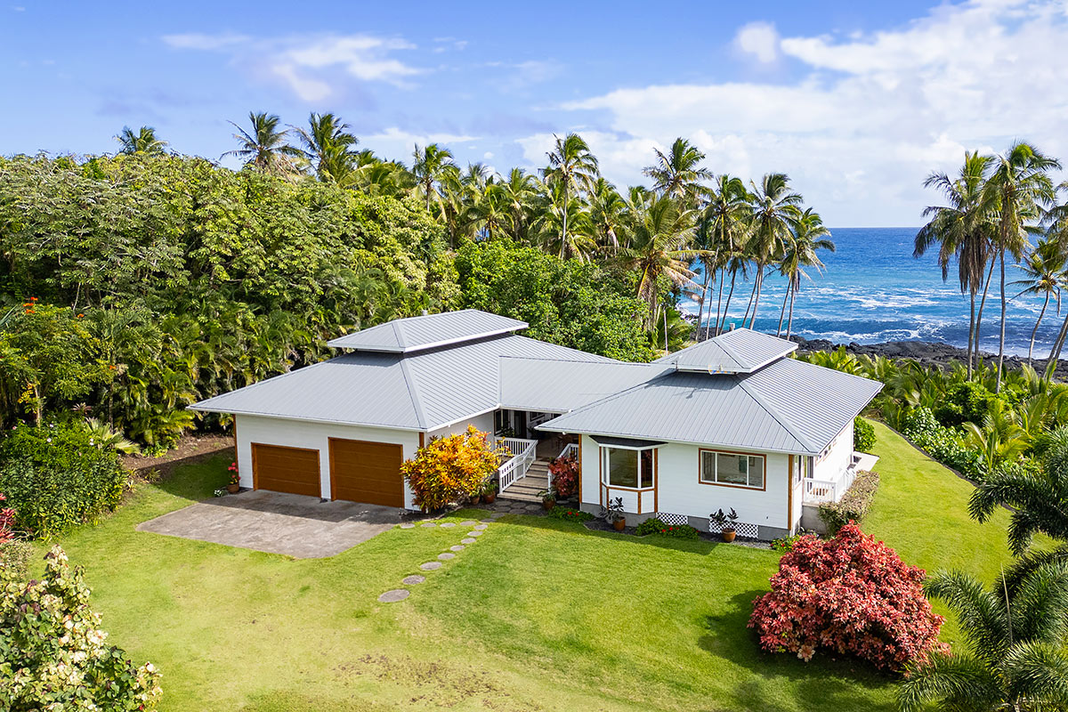 13-5725 Kalapana Kapoho Beach Road Pahoa, HI 96778 - Photo 1 of 25 a aerial view of a house with swimming pool and a yard