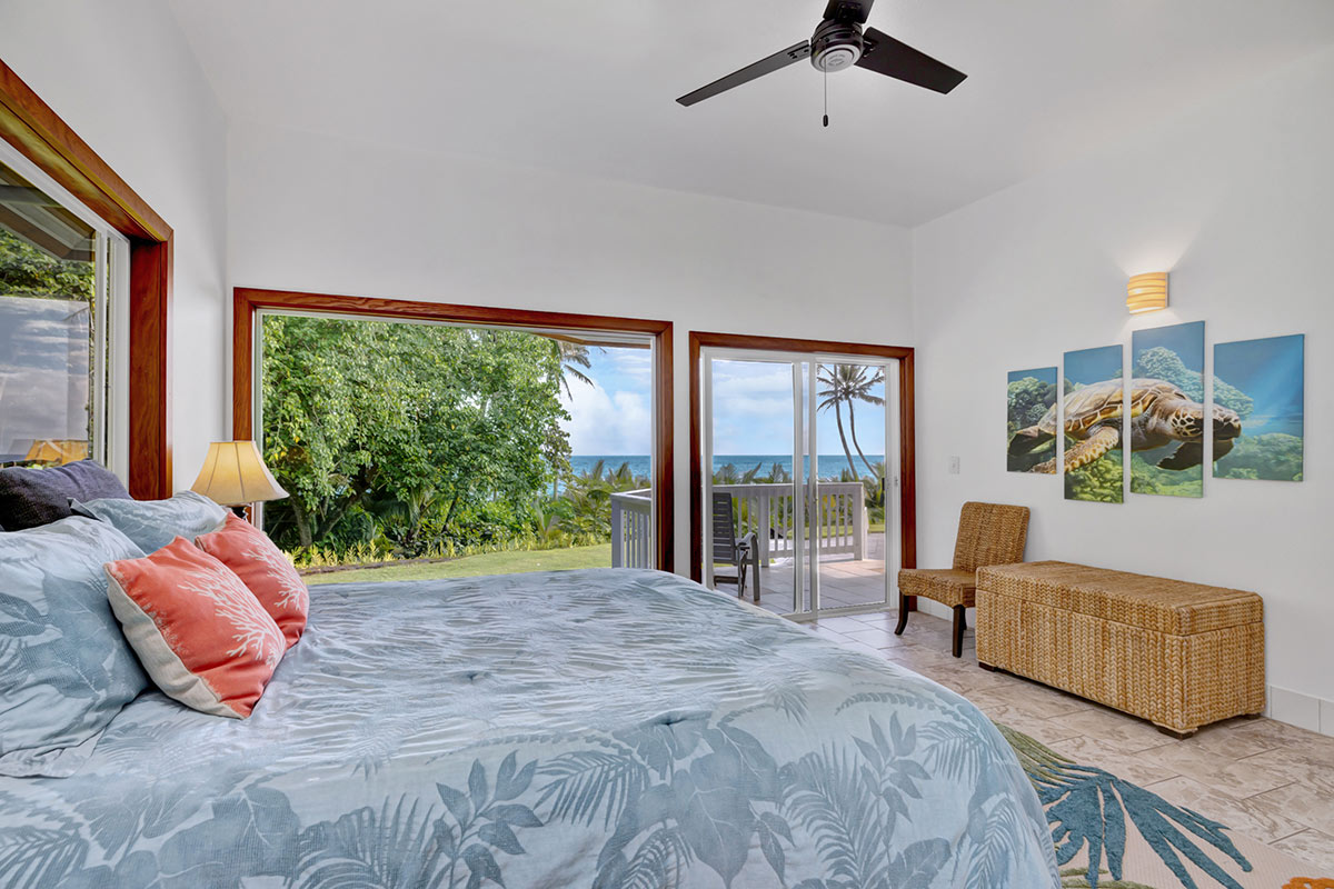 13-5725 Kalapana Kapoho Beach Road Pahoa, HI 96778 - Photo 11 of 25 a bedroom with a bed and glass window
