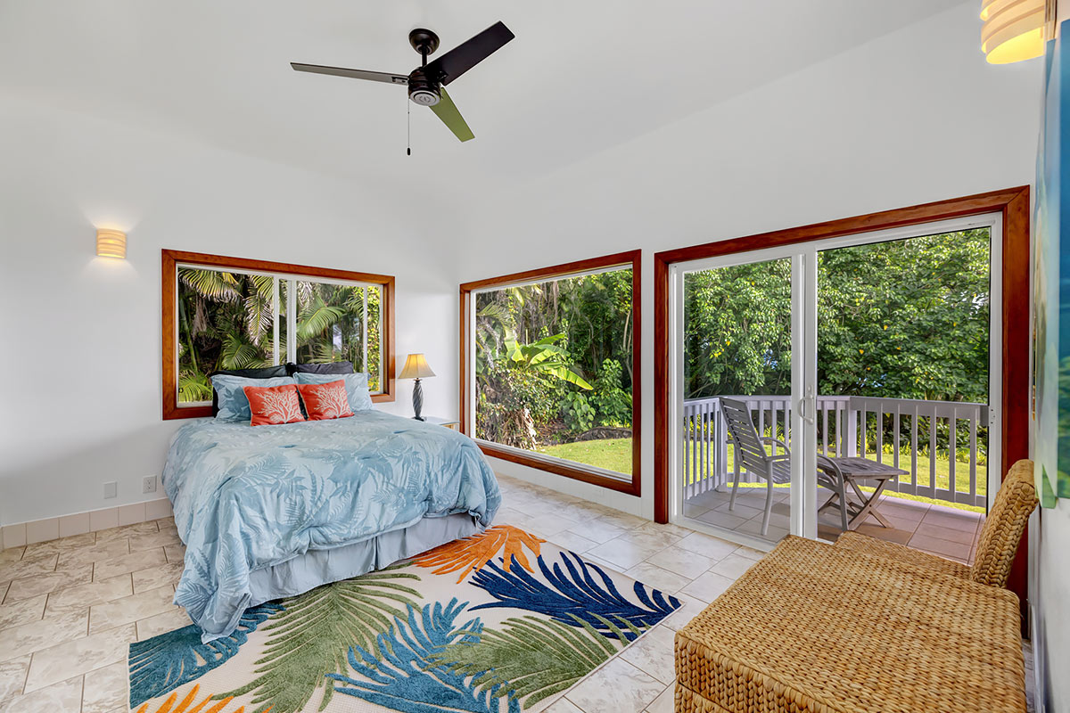 13-5725 Kalapana Kapoho Beach Road Pahoa, HI 96778 - Photo 12 of 25 a bedroom with a bed and glass window