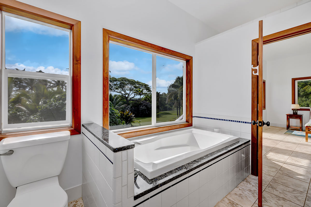 13-5725 Kalapana Kapoho Beach Road Pahoa, HI 96778 - Photo 13 of 25 a bathroom with a sink and a large mirror next to a window