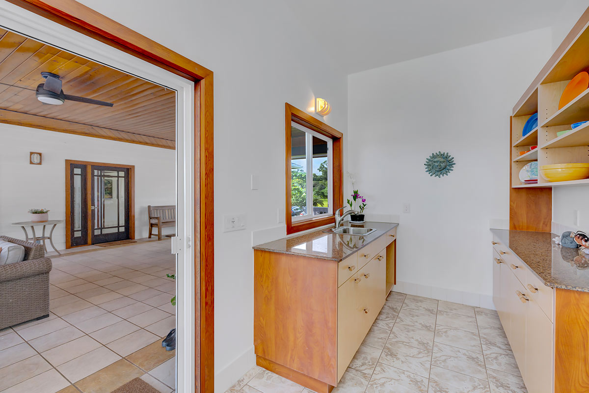 13-5725 Kalapana Kapoho Beach Road Pahoa, HI 96778 - Photo 17 of 25 a kitchen with stainless steel appliances granite countertop a stove and a sink