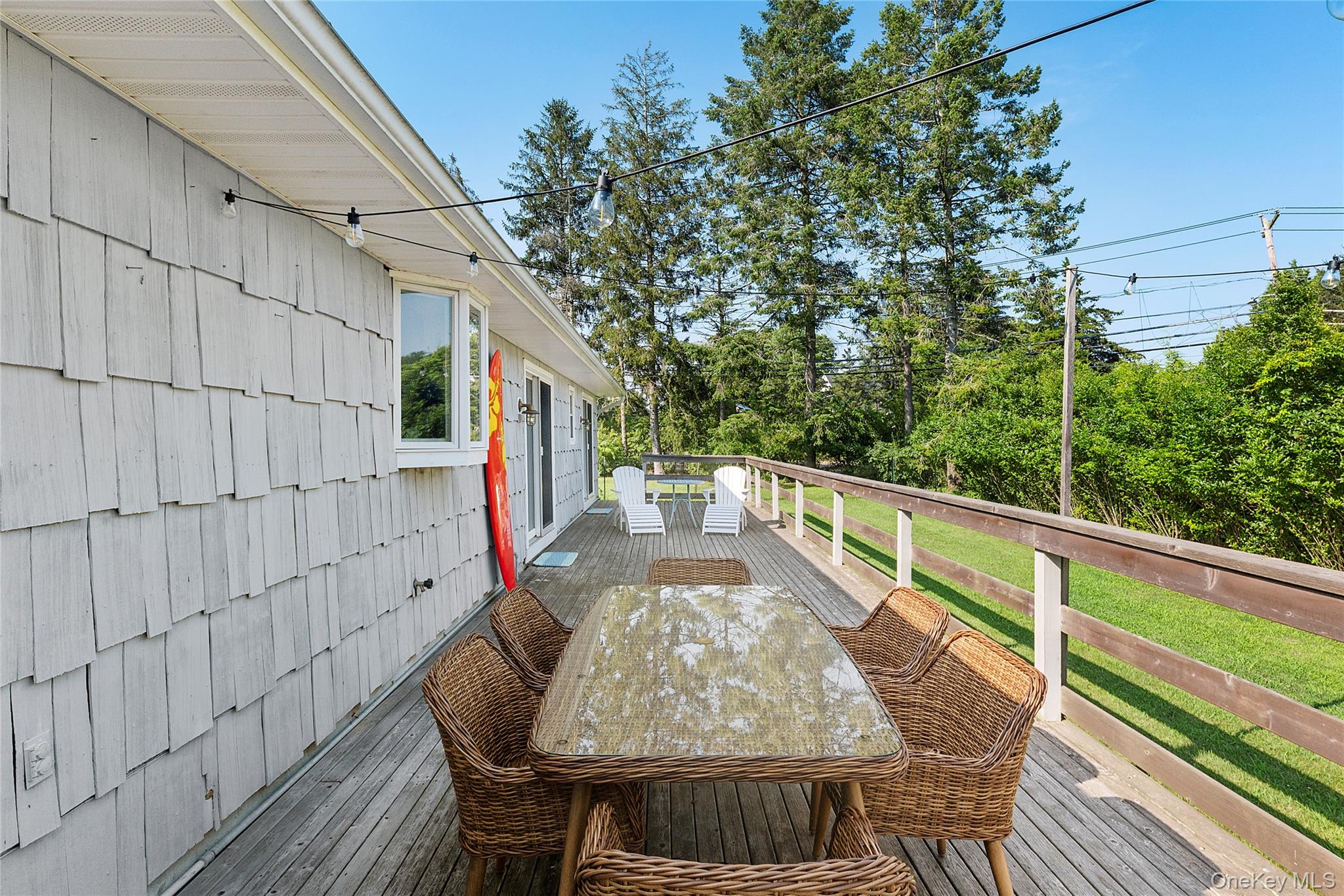 38 Liberty Street Westhampton Beach, NY 11978 - Photo 15 of 23 Wooden terrace featuring outdoor dining space
