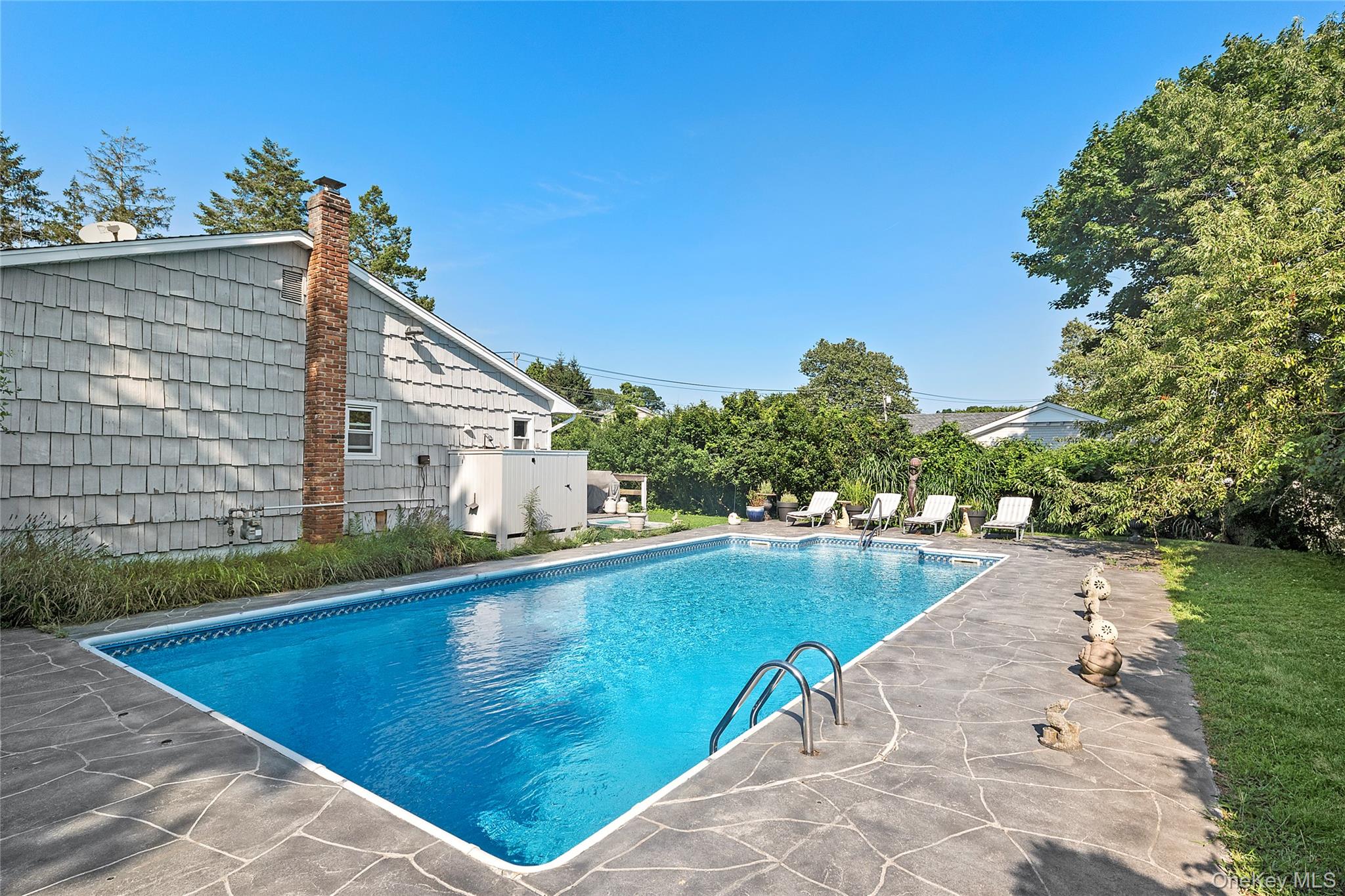 38 Liberty Street Westhampton Beach, NY 11978 - Photo 17 of 23 View of swimming pool with a patio area