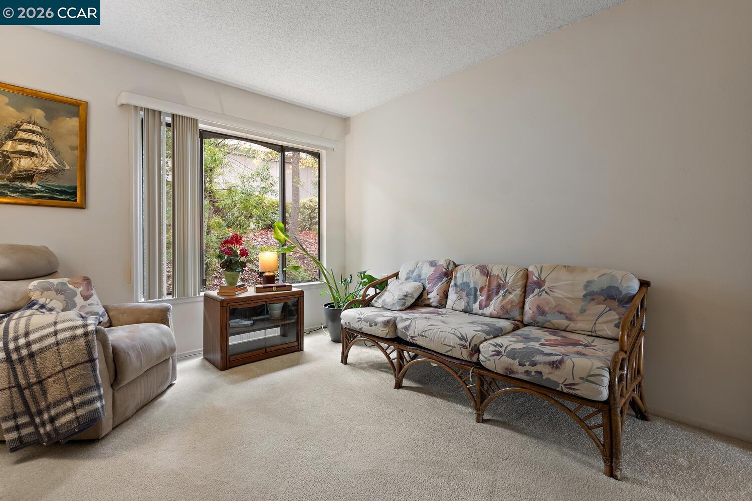 2709 Golden Rain Road, Unit 6 Walnut Creek, CA 94595 - Photo 13 of 46 a living room with furniture and a window