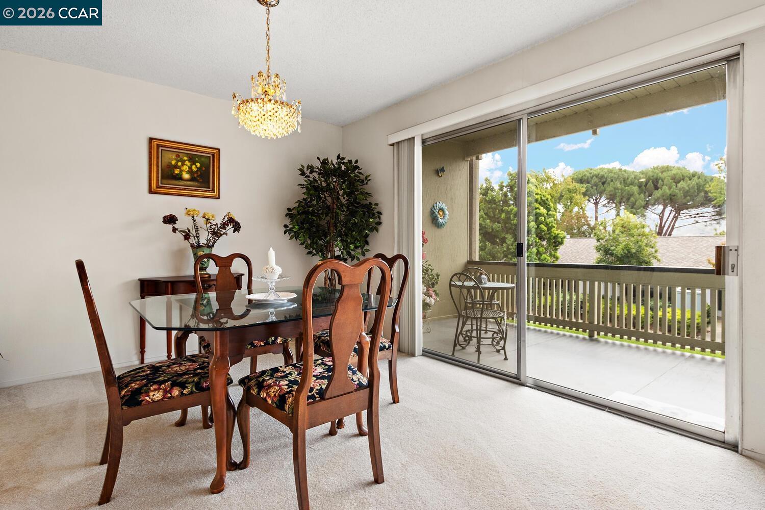2709 Golden Rain Road, Unit 6 Walnut Creek, CA 94595 - Photo 7 of 46 a view of a dining room with furniture window and outside view
