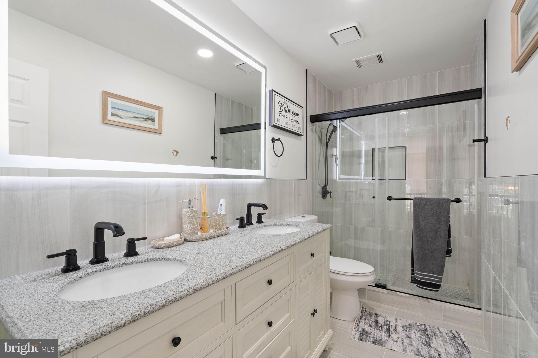 7616 Seabrook Lane Springfield, VA 22153 - Photo 19 of 37 Modern elegance in a serene bathroom.
