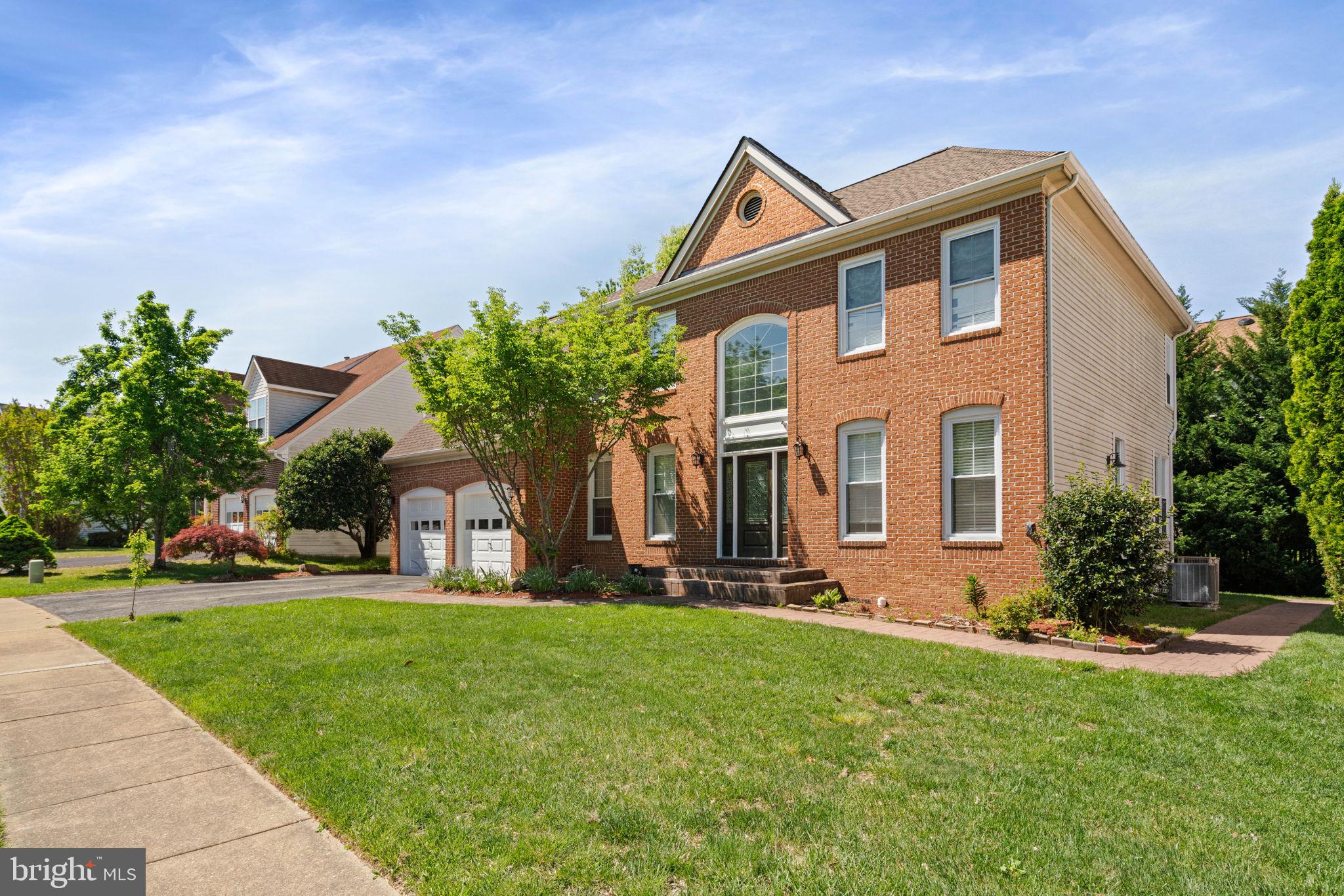 7616 Seabrook Lane Springfield, VA 22153 - Photo 2 of 37 Charming brick home with lush greenery.