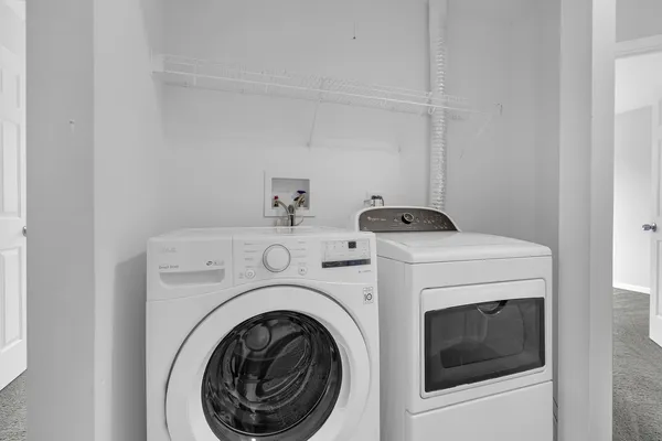 a utility room with dryer and washer