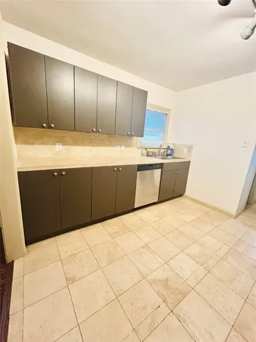 a large bathroom with a large tub and shower