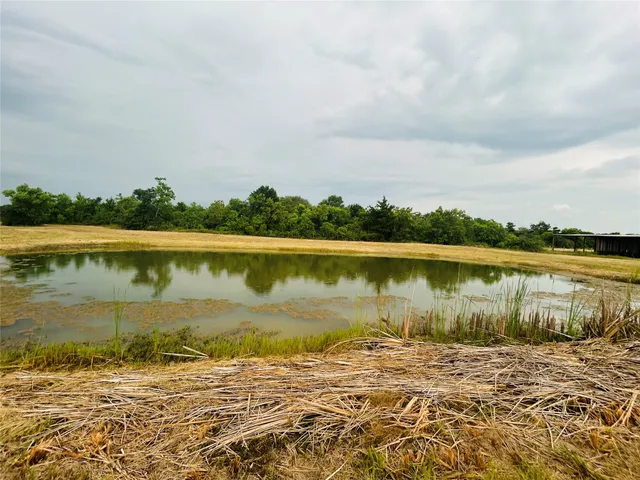 a view of a lake with a big yard