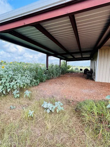 a view of a backyard of the house