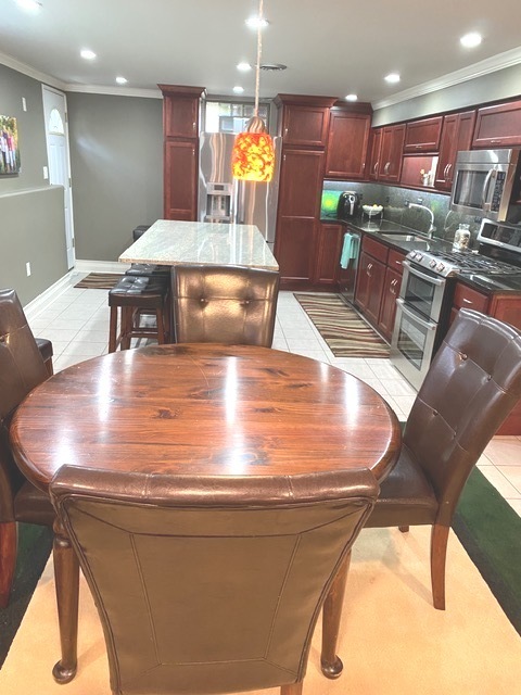 314 Ruth Avenue St. Charles, IL 60174 - Photo 21 of 36 a view of a kitchen with kitchen island a chandelier and living room view