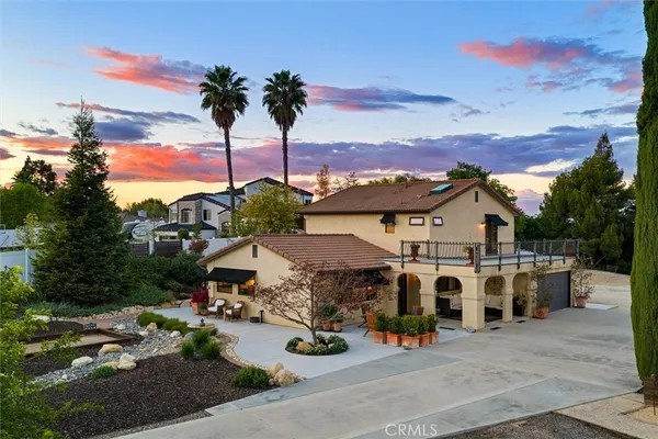 an aerial view of a house with a garden