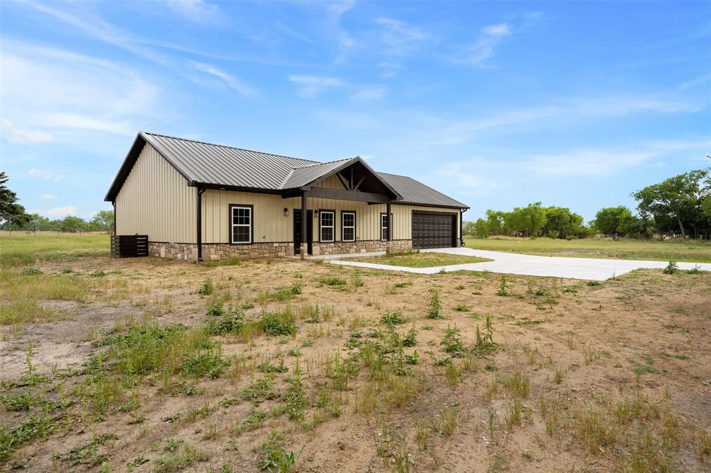 121 Brazier Road Ennis, TX 75119 - Photo 5 of 31 a front view of a house with a yard