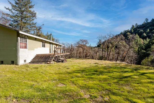 a view of balcony with furniture and wooden floor