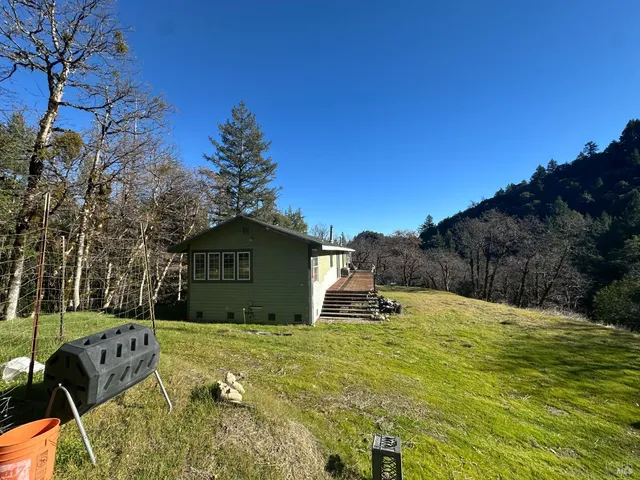 a view of a chairs and table in the balcony