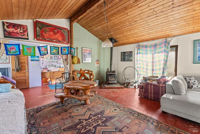 a view of balcony with wooden floor and outdoor seating