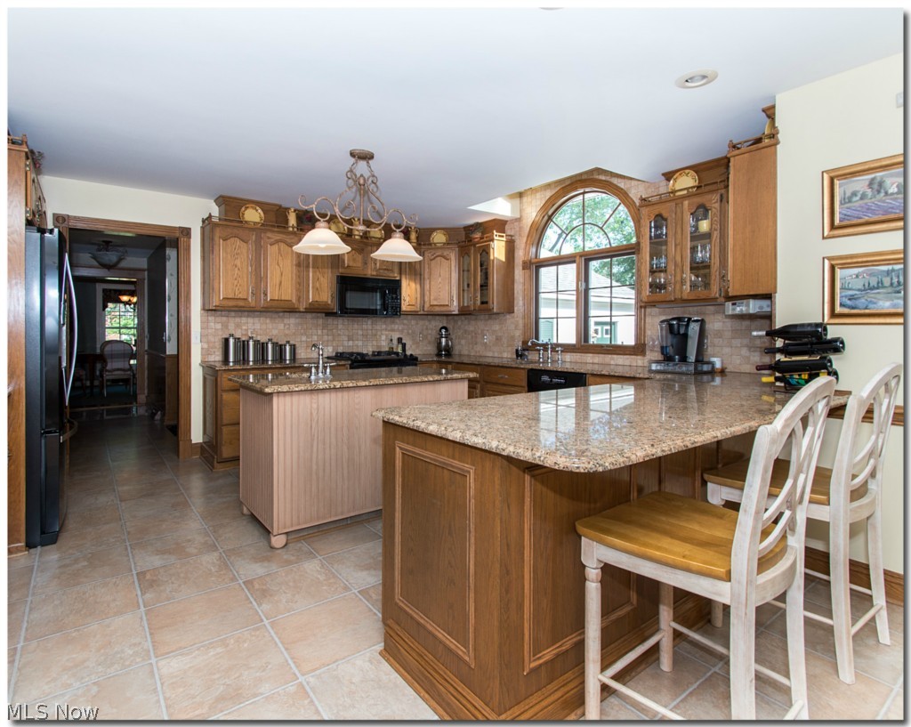 273 Barrington Ridge Road Painesville, OH 44077 - Photo 9 of 25 GRAB A QUICK BITE OR A CUP OF COFFEE AT THE KITCHEN BAR.