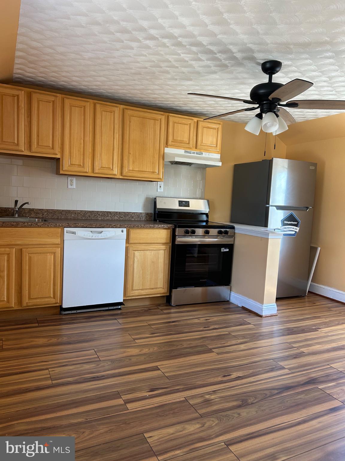 431 Rhawn Street Philadelphia, PA 19111 - Photo 3 of 12 Modern kitchen with warm wood tones.