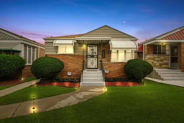 a front view of a house with garden
