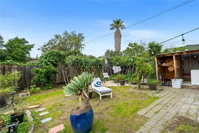a view of swimming pool with outdoor seating and plants