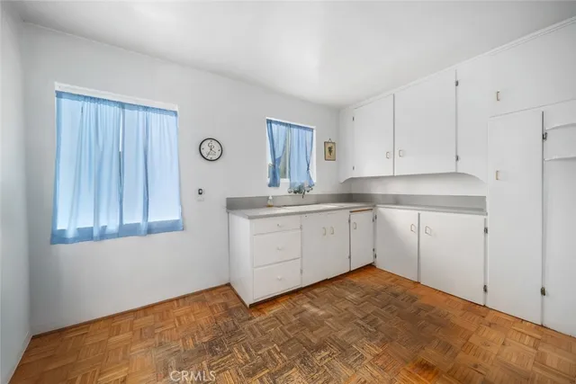 a kitchen with a stove a sink and a refrigerator