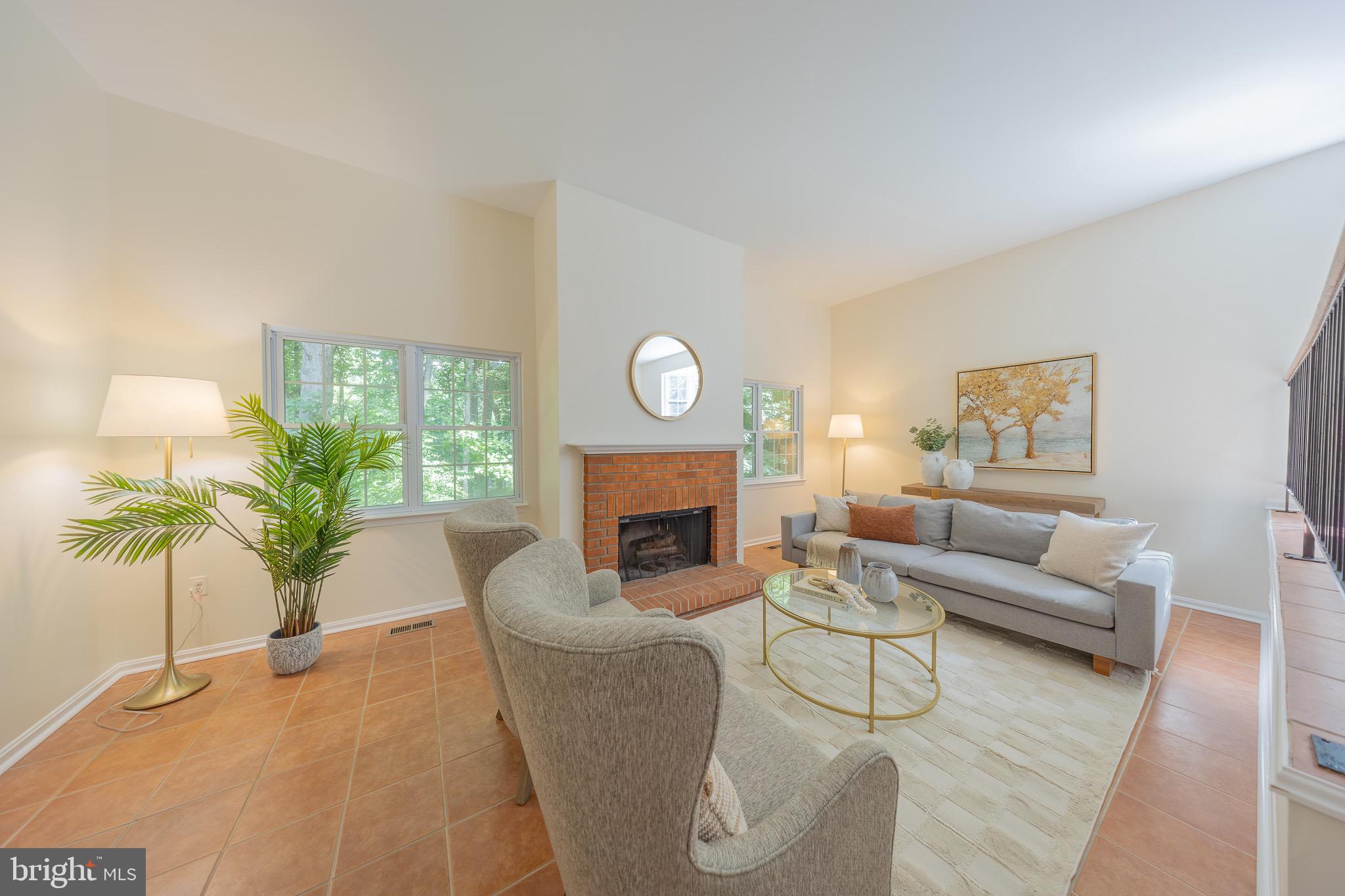 11714 Dry River Court Reston, VA 20191 - Photo 3 of 18 a living room with furniture a fireplace and a large window