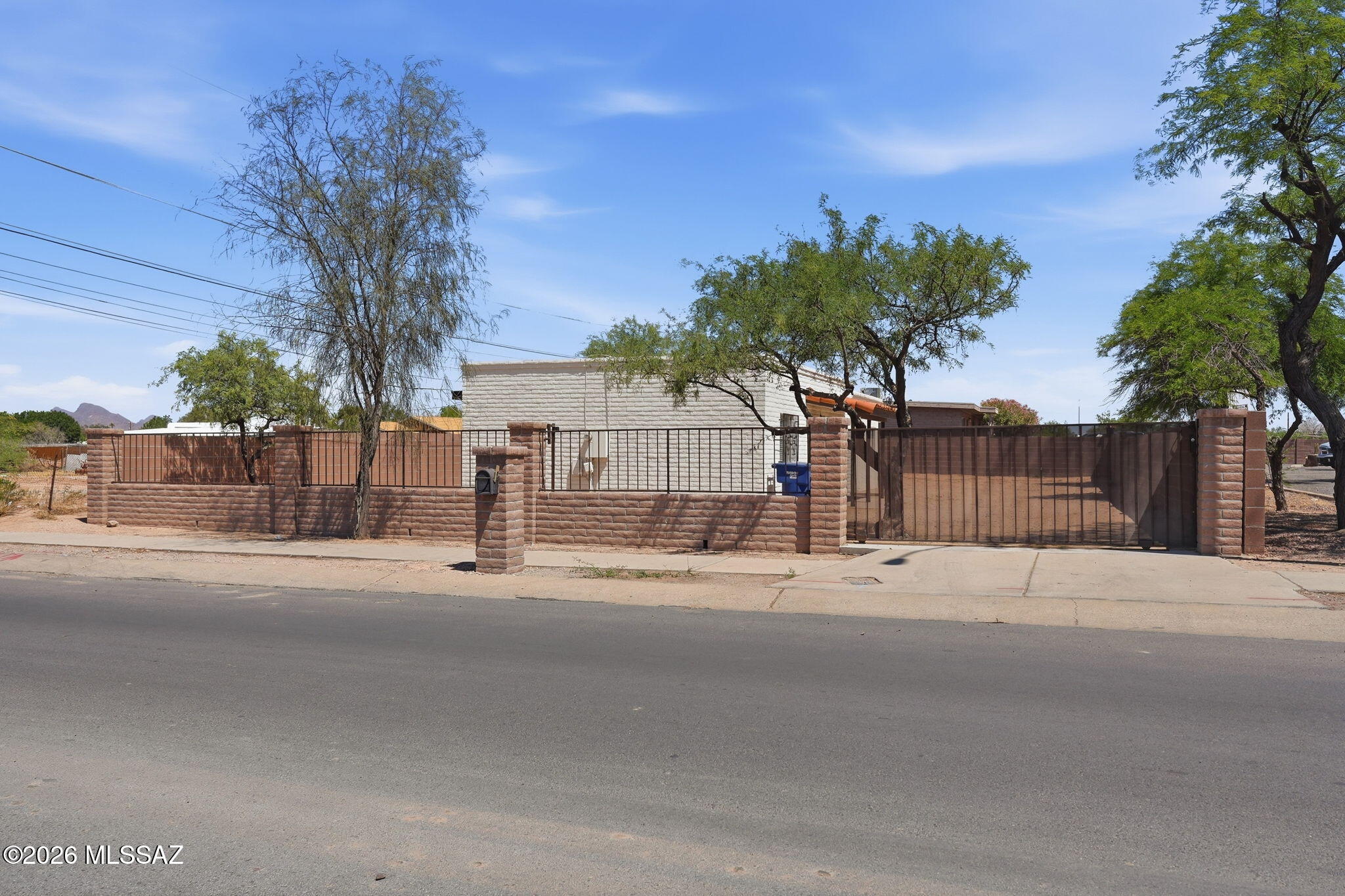 136 West Elvira Road Tucson, AZ 85756 - Photo 3 of 27 a view of street with a building in the background