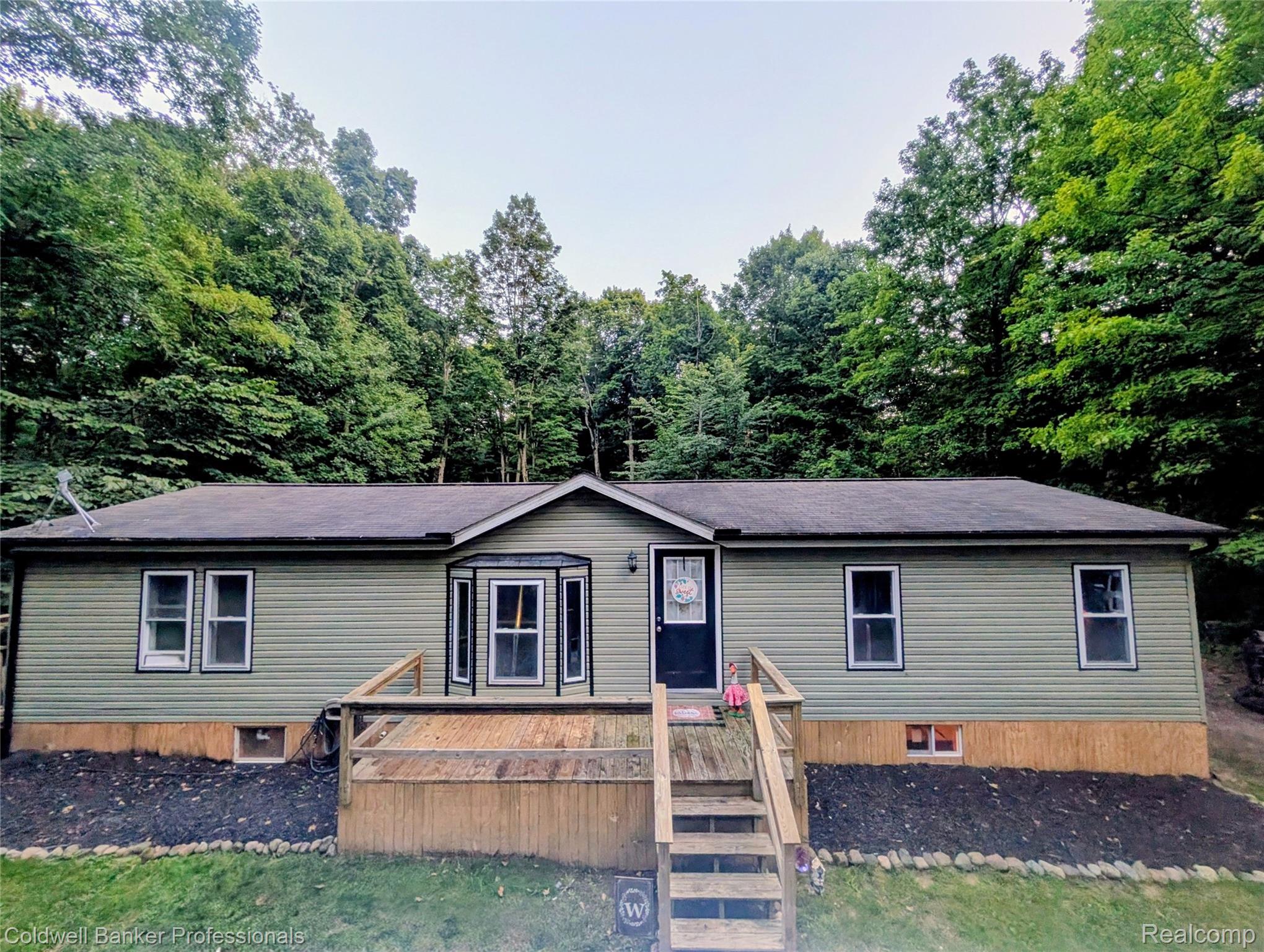 5323 English Road Clifford, MI 48727 - Photo 2 of 46 Ranch-style residence featuring horizontal siding and a dark shingle roof