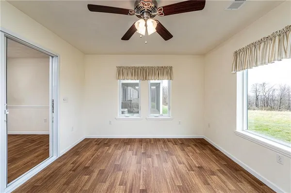 a view of empty room with windows