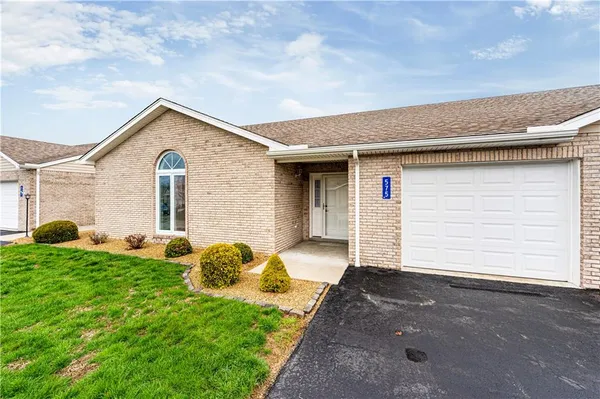 a front view of house with yard