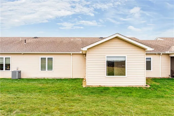 a view of a house with a backyard