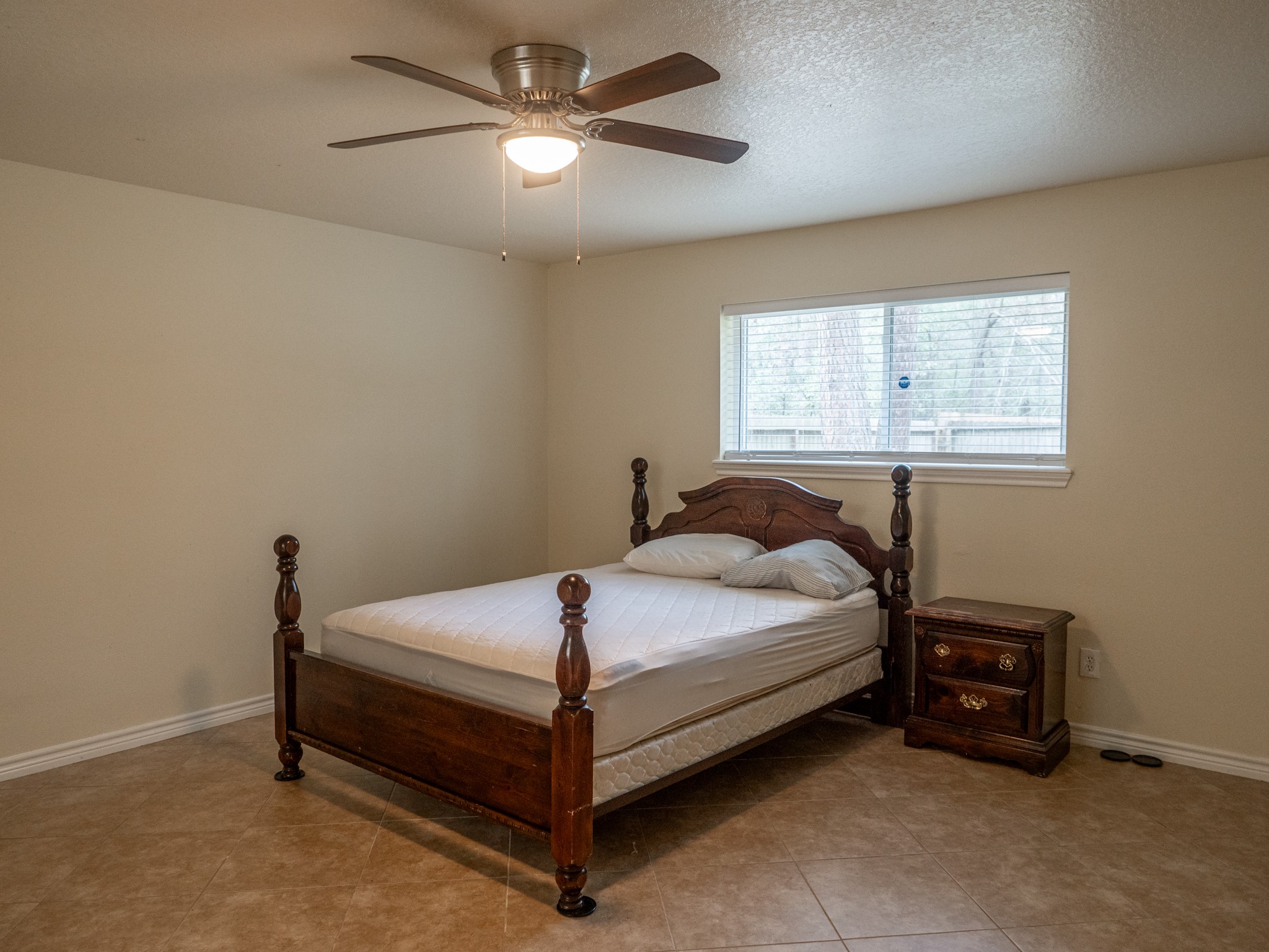 3302 Willie Way Spring, TX 77380 - Photo 16 of 25 a bed sitting in a bedroom next to a window